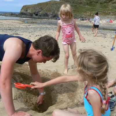 Philip digging a hole with Abi